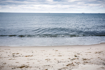 Empty beach background of free space and ocean landscape with dark sky 