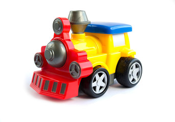 toy train. children's toy. plastic yellow with red the train with a blue roof