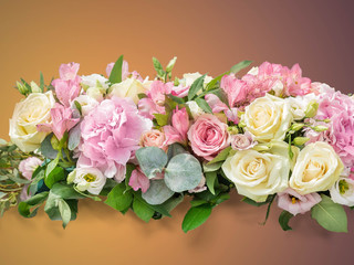 Flowers Gentle art composition. A bouquet from branches an eucalyptus, a hydrangea, Alstroemeria, gentle roses on a brown gradient background