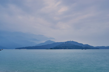 Beautiful sunset scenics of Sun Moon Lake with the surrounding mountains are the highlight at this sprawling lake at Yuchi, Nantou in Taiwan.