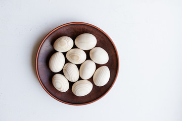 Wooden egg tableware on white background