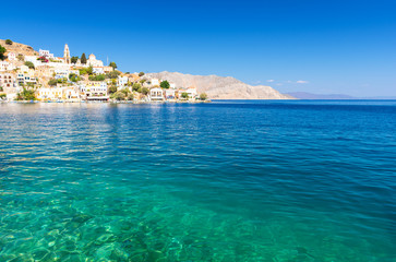 crystal clear water of aegean sea on Symi island in Greece