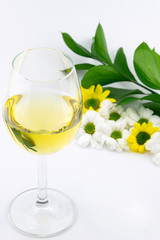 Glass of White Whine and Flowers