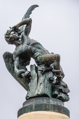 Statue of Fallen Angel on a the fountain in Buen Retiro Park also called simply El Retiro in Madrid, capital city of Spain