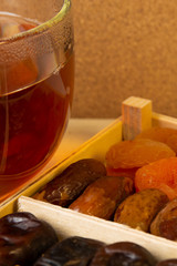 Oriental sweets, dried fruit with a cup of tea