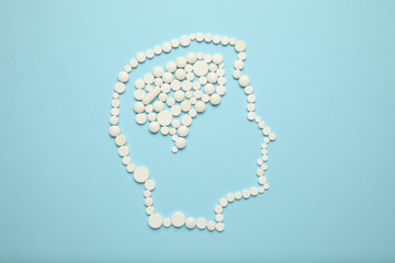 Silhouette of head and brain from medical pills. Headache and cancer treatment.