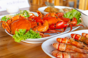 Steamed crabs with seafood spicy sauce.