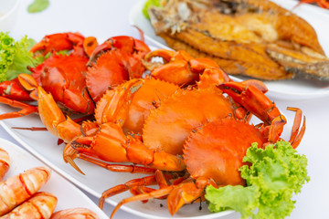 Steamed crabs with seafood spicy sauce.