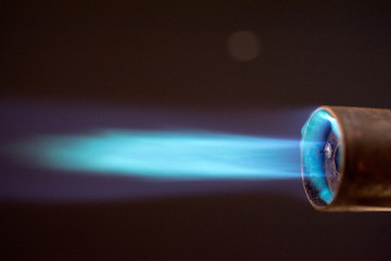 blowtorch torch burner blue flame, Industrial gas burner, against black,  close up