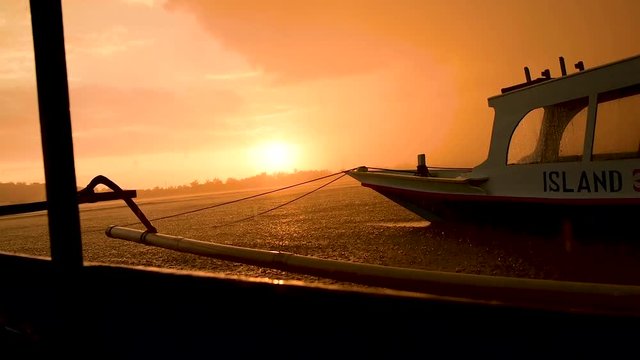 heavy rain in Indonesia as sunsets by the docks, za01