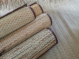 Wickerwork mat texture made from dry sedge background.Closeup surface texture of hand made craft...