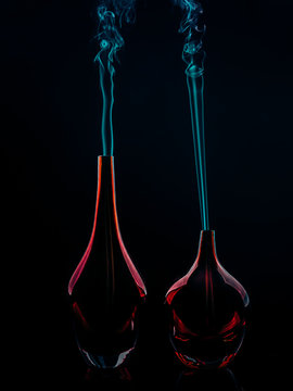 Glass bottles emitting smoke