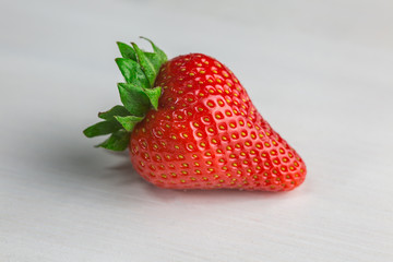 Strawberries on white wood 