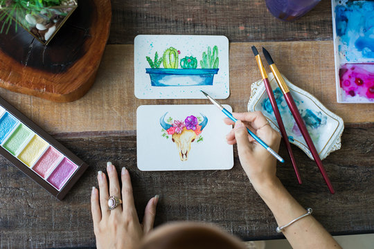 Mexican watercolor, cactus and cattle cow paintings.