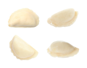 Set of delicious cooked dumplings on white background