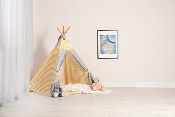 Cozy child room interior with play tent near window