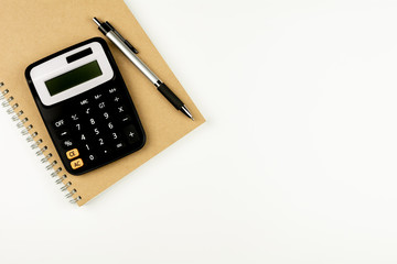 calculator and office supplies on white table. - top view with copy space.