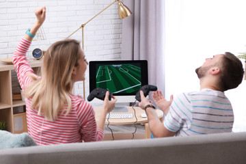 Young couple playing video game at home © New Africa
