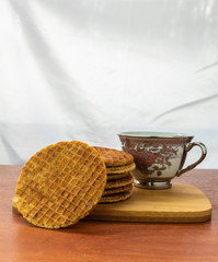 Tower of stroopwafels in front of a cup of coffee