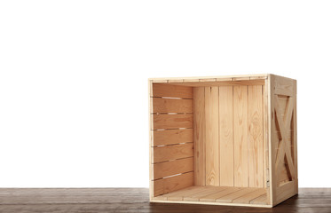 Wooden crate on table against white background. Space for text