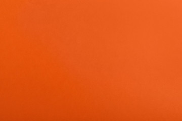 Abstract orange background, top view. Colorful paper