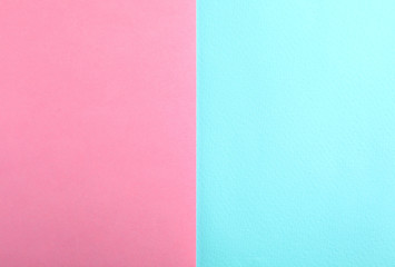 Blue and pink paper sheets as colorful background, top view