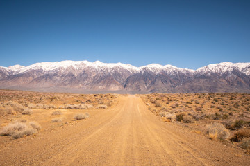 Fototapeta na wymiar Unpaved road through the Sierra Nevada - travel photography
