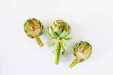 Fresh green Italian Artichoke isolated on white background. Organic local produce vegetable. Vegan...