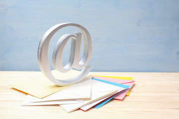 e-mail symbol on wooden background with copy space