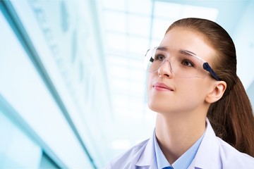 Male doctor with stethoscope on blurred hospital background