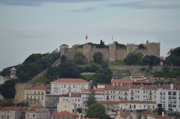 Wonderful views of the Medieval Castle of San Jorge from the San Pedro de Alcantara Garden in Lisbon. Nature, architecture, history, street photography. April 11, 2014. Lisbon, Portugal.