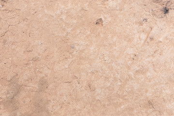 Brown dry soil or cracked ground texture background.