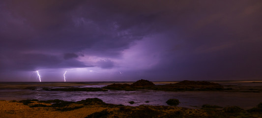 Fototapeta na wymiar Thunderstorm on mediterranean sea beach