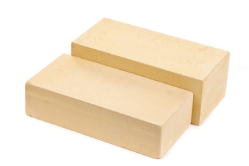 Two yellow ceramic bricks at the white background, isolated