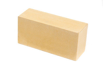 Yellow ceramic brick at the white background, isolated