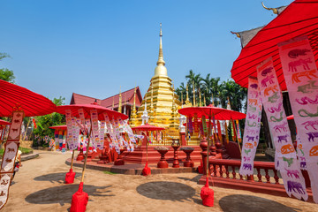 Prayer flags tung Hang with umbrella or Northern traditional flag hang on sand pagoda in the Phan Tao temple for Songkran Festival is celebrated in a traditional New Year's Day in Chiang Mai,Thailand