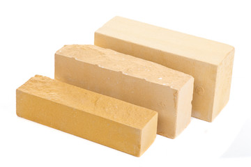 Three yellow long ceramic bricks at the white background, isolated