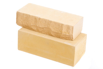 Two yellow ceramic bricks at the white background, isolated