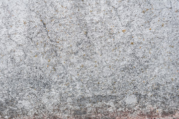 Wall fragment with scratches and cracks