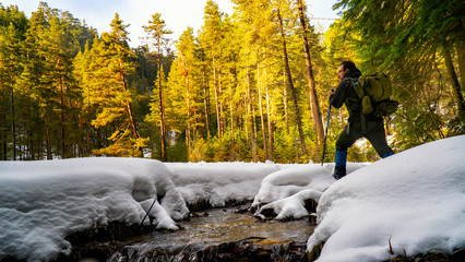 camper man trekking in snowy forest / yenice forest in turkey