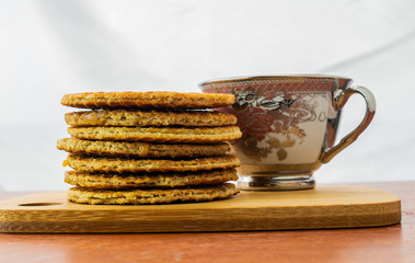 Tower of stroopwafels in front of a cup of coffee