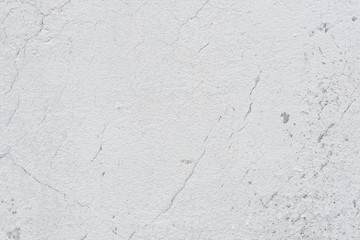 Wall fragment with scratches and cracks