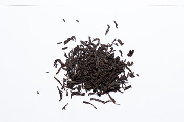 black tea leaves on white background