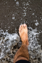 Foot in the water at the beach