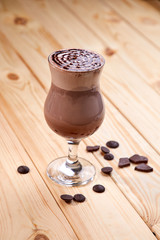cup of coffee on the wooden background