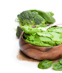 Green broccoli and spinach puree isolated on white