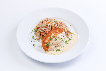 cutlet with buckwheat on the white background