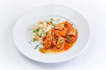 chicken with barley on teh white plate