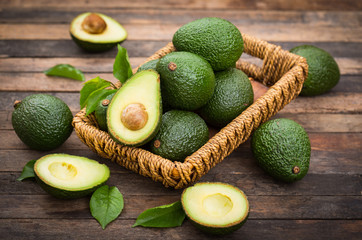 Fresh organic avocado on the wooden table