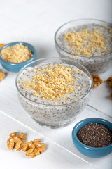 Chia pudding made with milk, banana and decorated with walnut